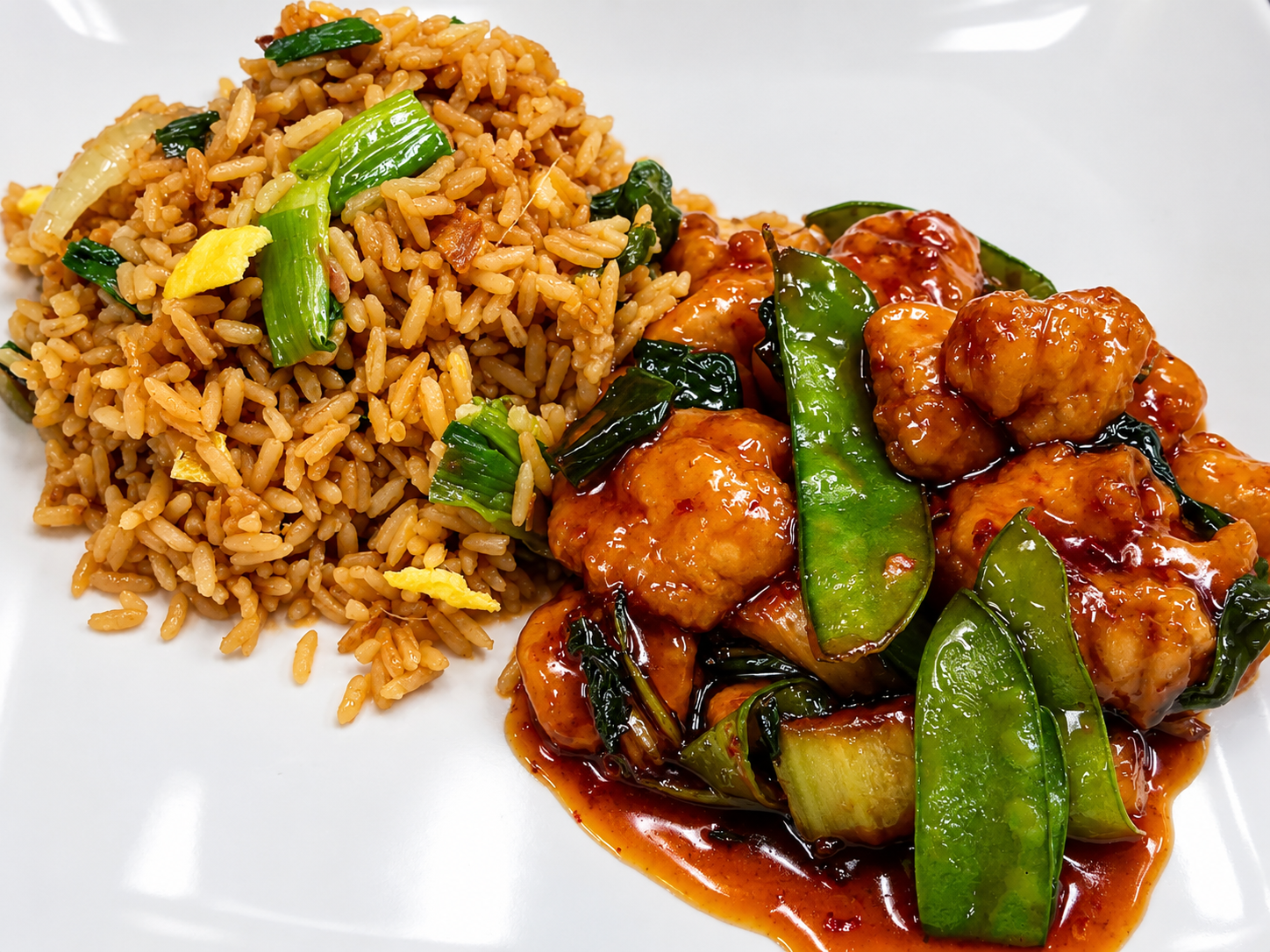 Glazed chicken stir-fry with snow peas and fried rice